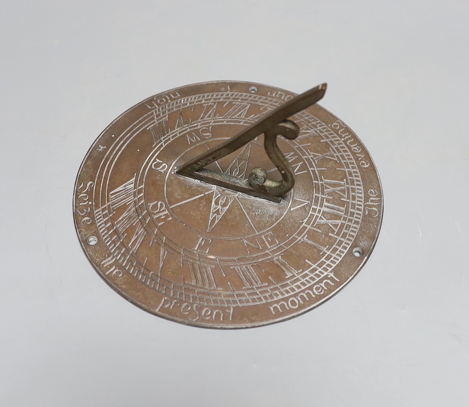 A cast brass sundial 19.5cm diameter